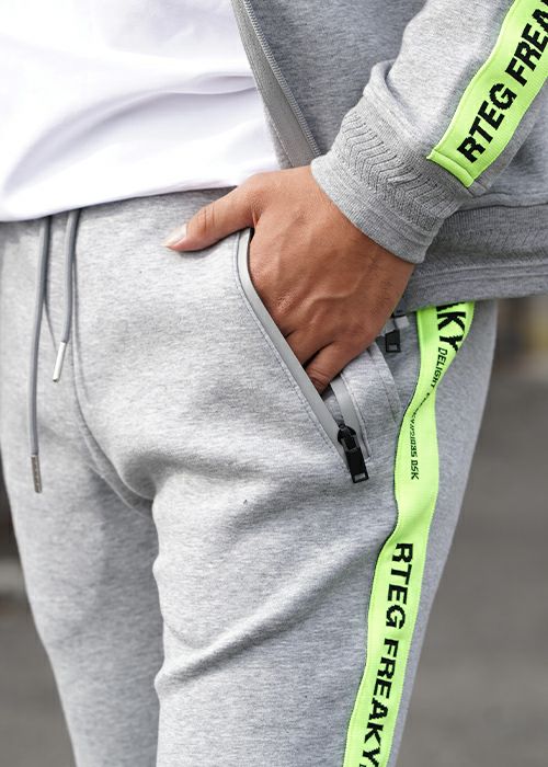 RTEG/ネオンテープジップスウェットパンツ | adamsJUGGLER（アダムス